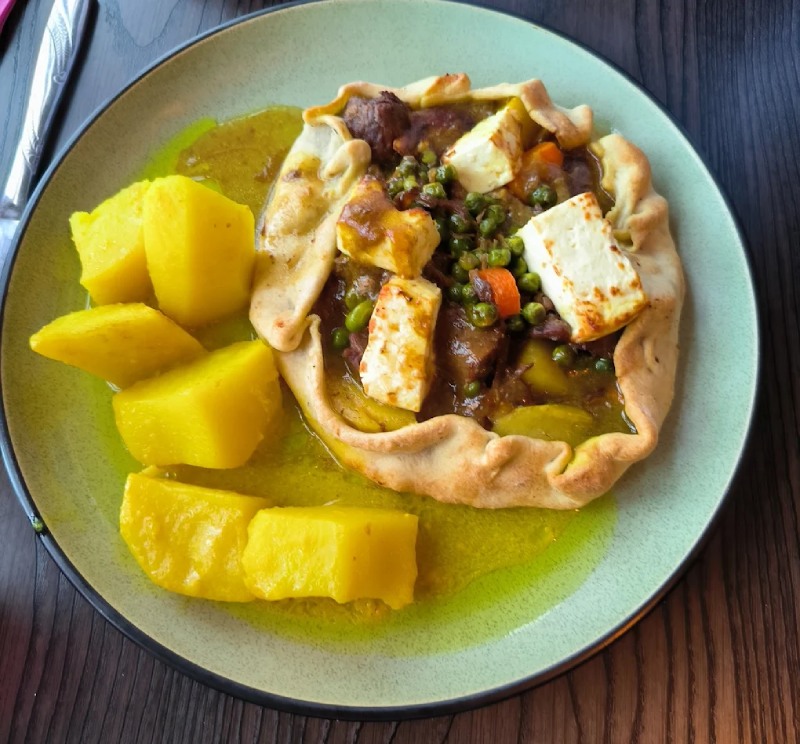  Lamb Kleftiko dish with feta, vegetables, and pastry crust, served with lemon 
potatoes at Greek Theory Falkirk 