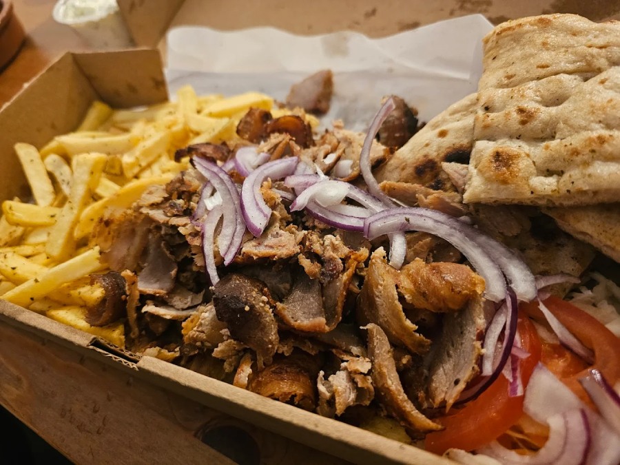 Loaded Merida from Greek Theory Falkirk, featuring gyro meat, fries, pita 
bread, red onion, and tomato